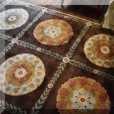 D01. Wool rug with medallions. 19'4” x 10'10” 